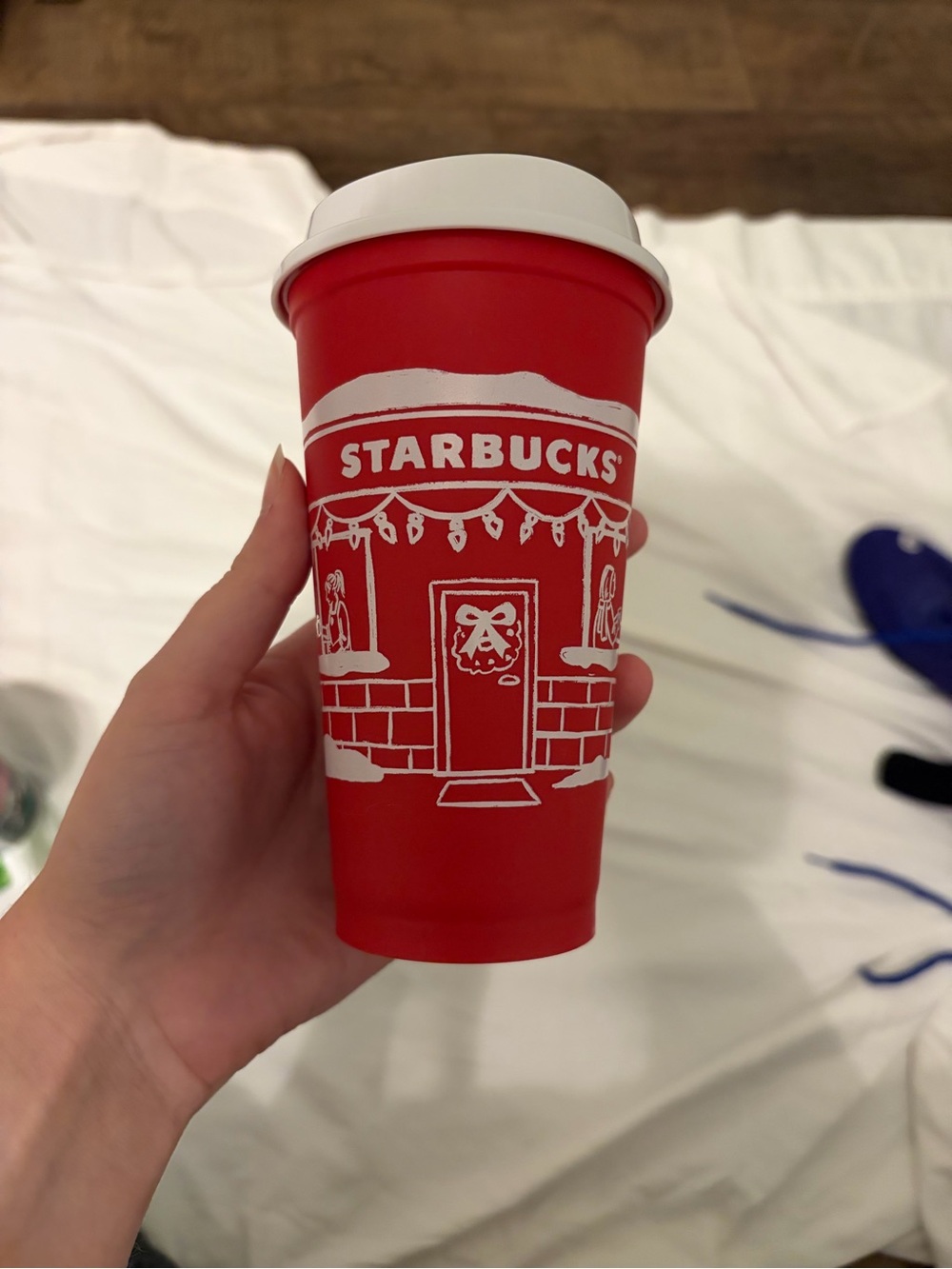 Starbucks Red Holiday Cup with White Lid and Festive Door Design